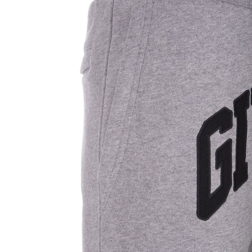 Pantalons de jogging gris en coton Givenchy, vêtements de sport pour homme avec logo subtil, confort et style décontracté.