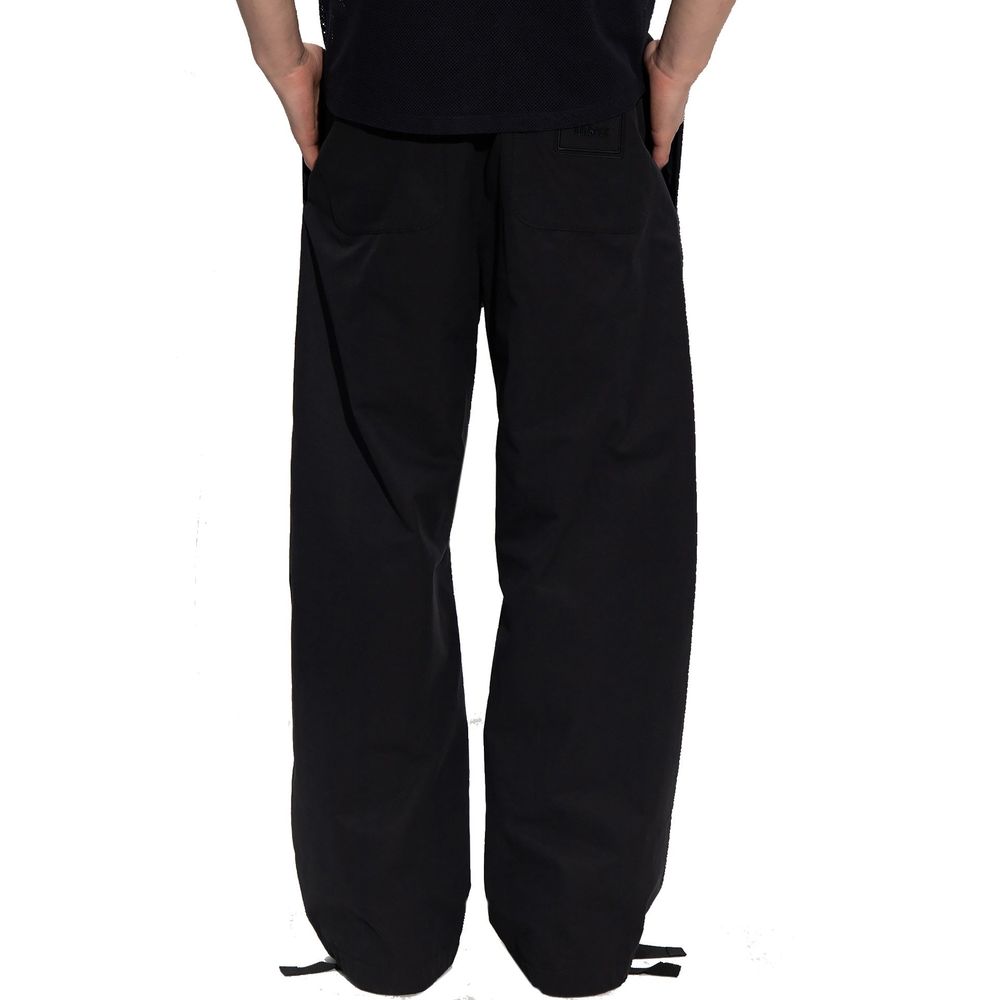 Pantalon décontracté noir en coton de la marque Versace, coupe confortable et style élégant pour un look casual.