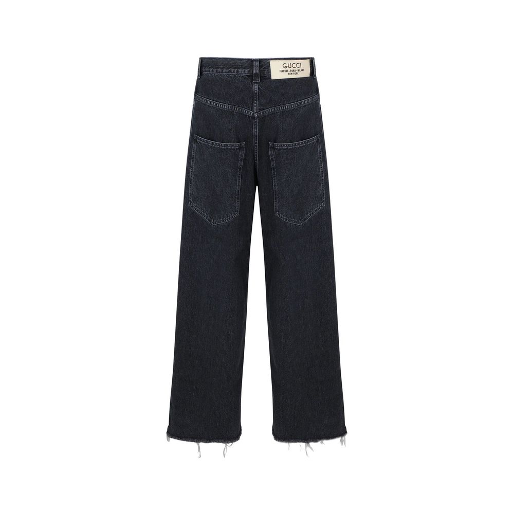 Jeans en denim noir Gucci en coton, coupe classique, avec détails de couture visibles, pour un style élégant et décontracté.