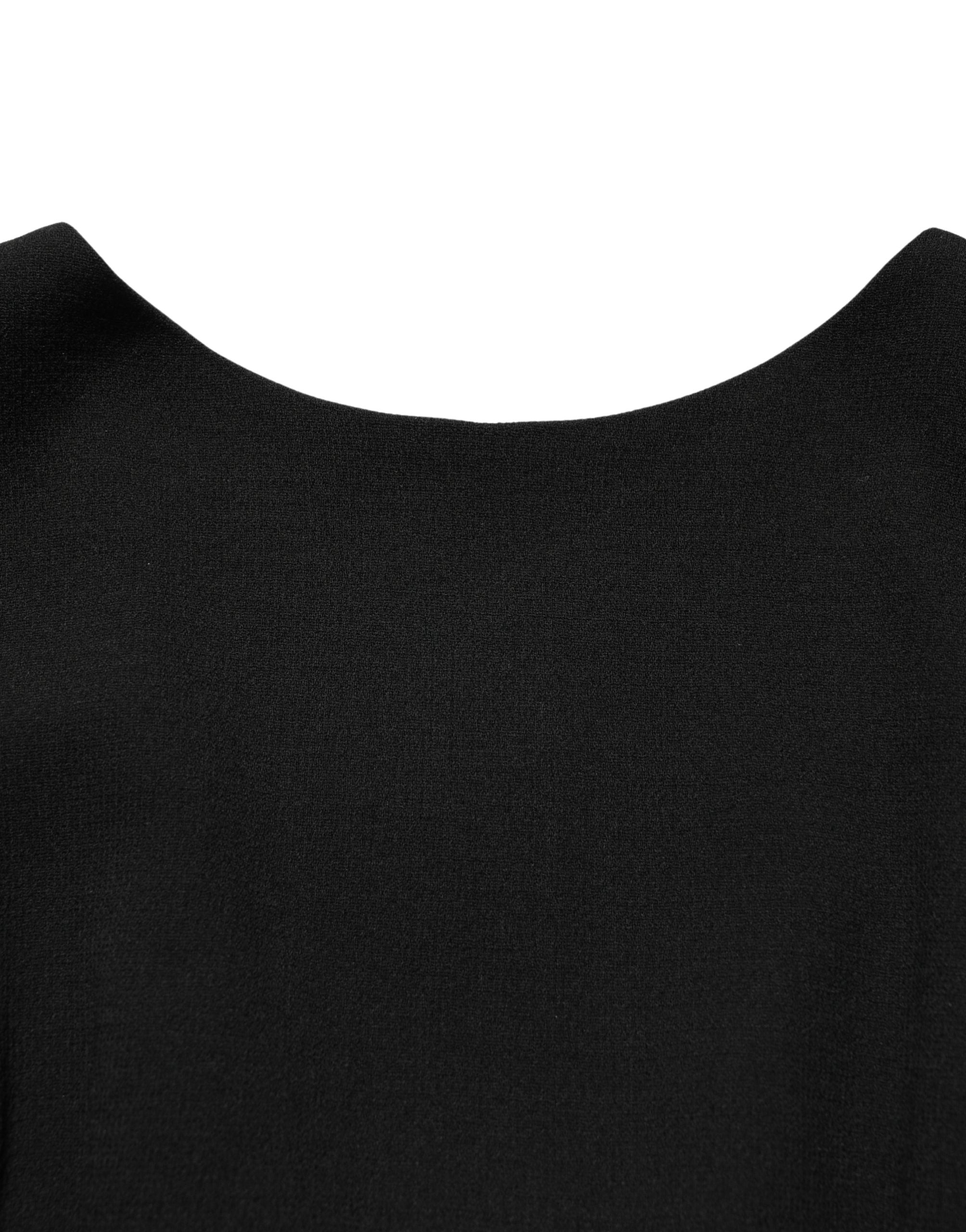 Robe midi en laine crêpe noire Dolce & Gabbana avec manches longues et coupe élégante, vue en plan rapproché.