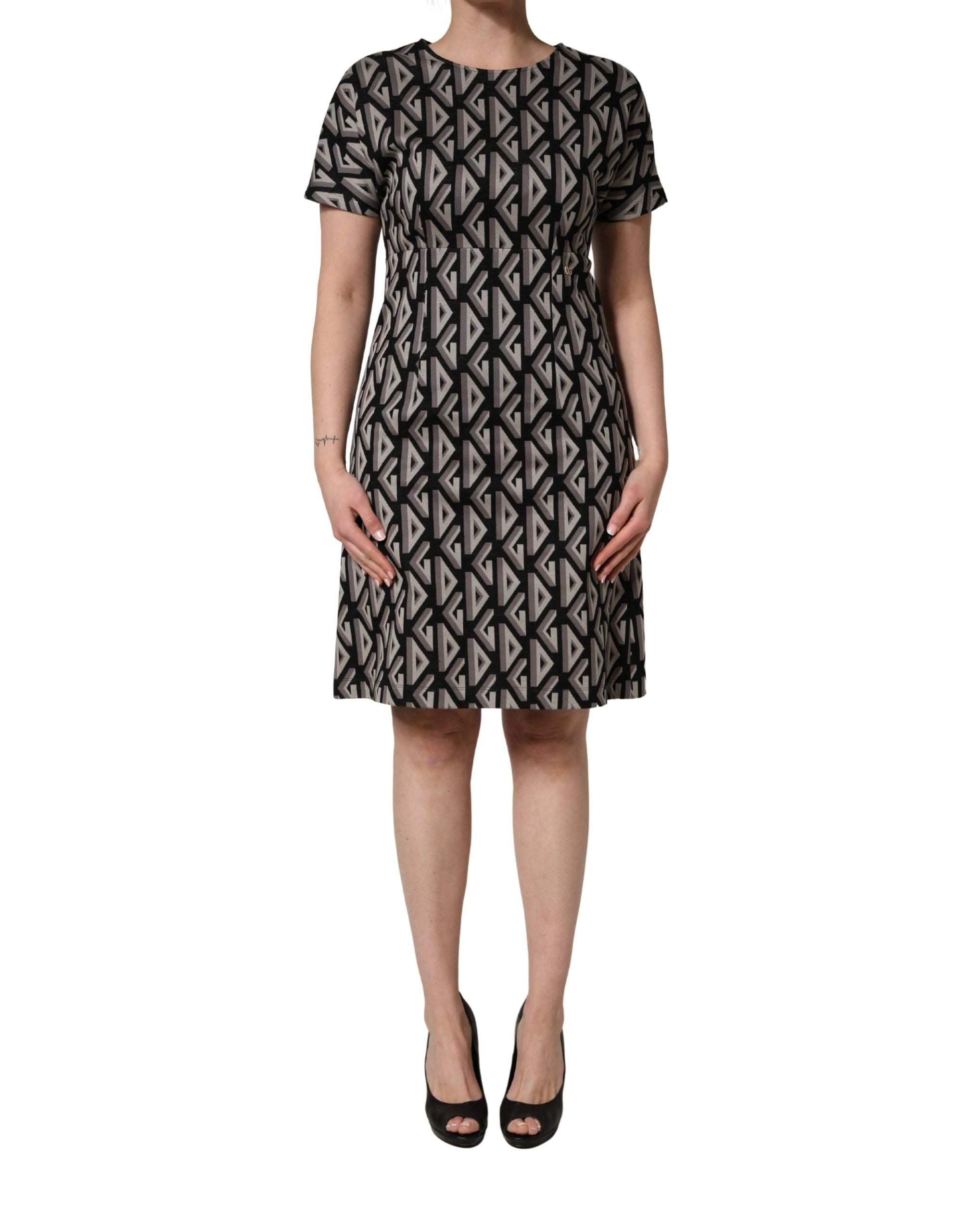 Robe midi en coton noire Dolce & Gabbana avec logo imprimé, longueur genou, style élégant et moderne.