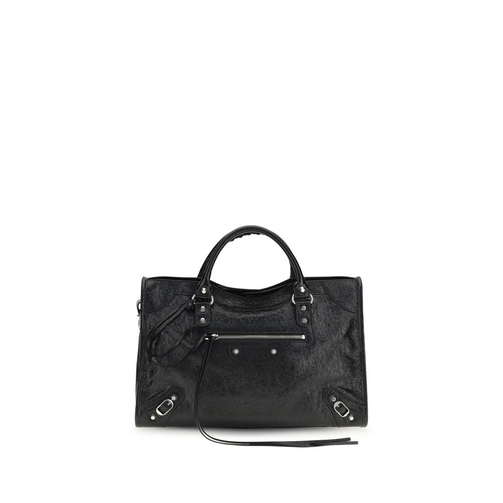 Sac à main Balenciaga en cuir d'agneau noir avec détails en or, vue de face, mettant en valeur le design élégant et la texture du cuir.