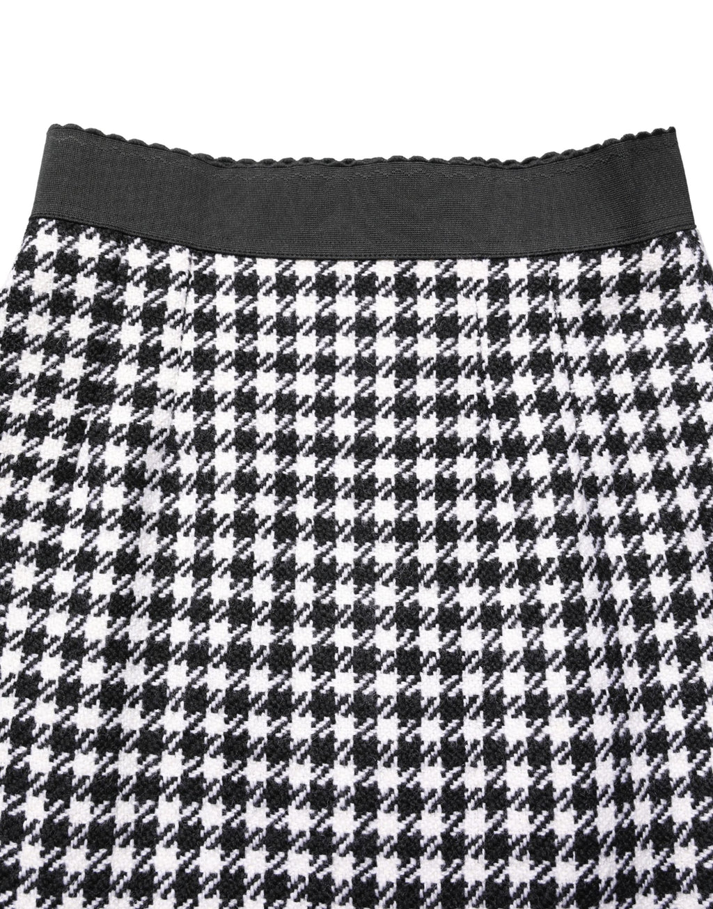 Jupe courte taille haute à carreaux houndstooth noir et blanc de Dolce & Gabbana, look élégant et sophistiqué.