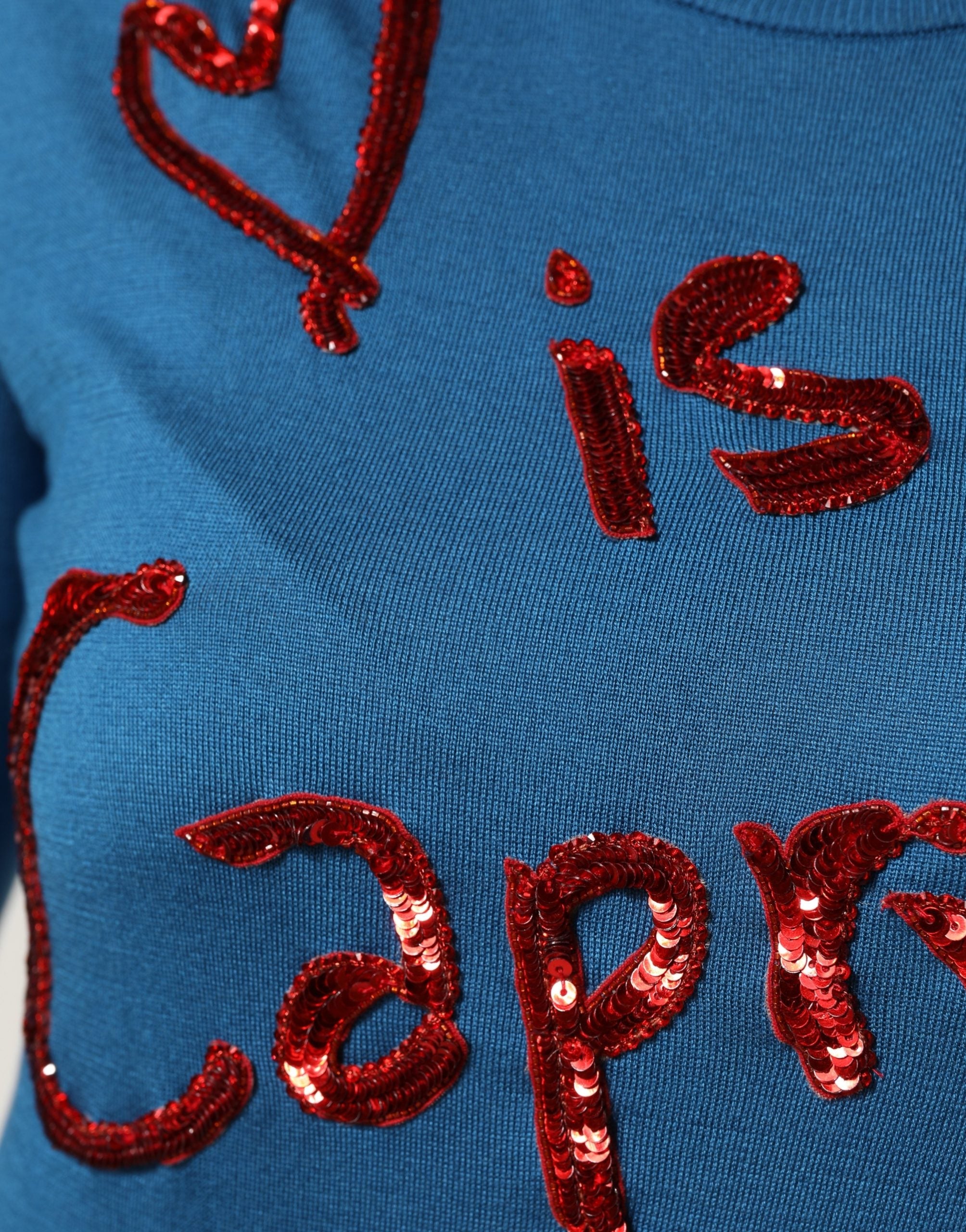 Pull en soie bleue Dolce & Gabbana avec sequins, col rond, pull-over élégant et sophistiqué pour femme.