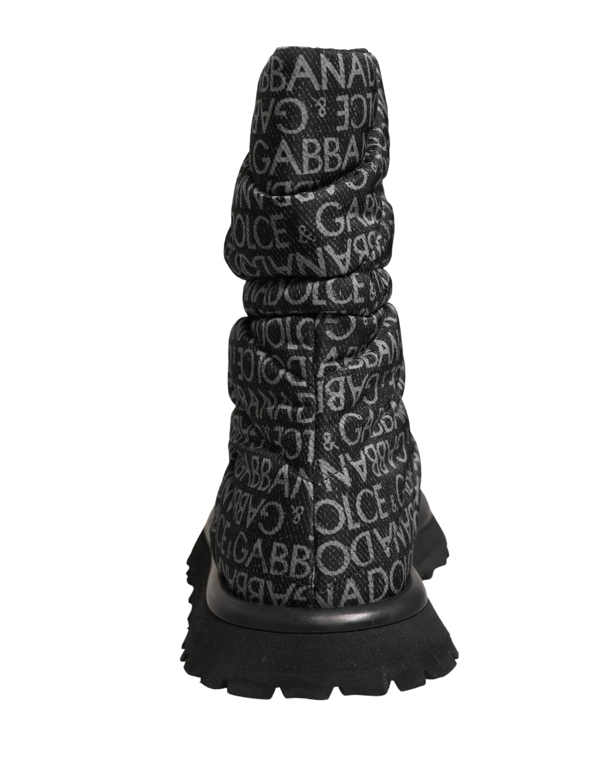 Bottes de neige noires Dolce & Gabbana avec logo imprimé, lacets et design en dentelle élégante.