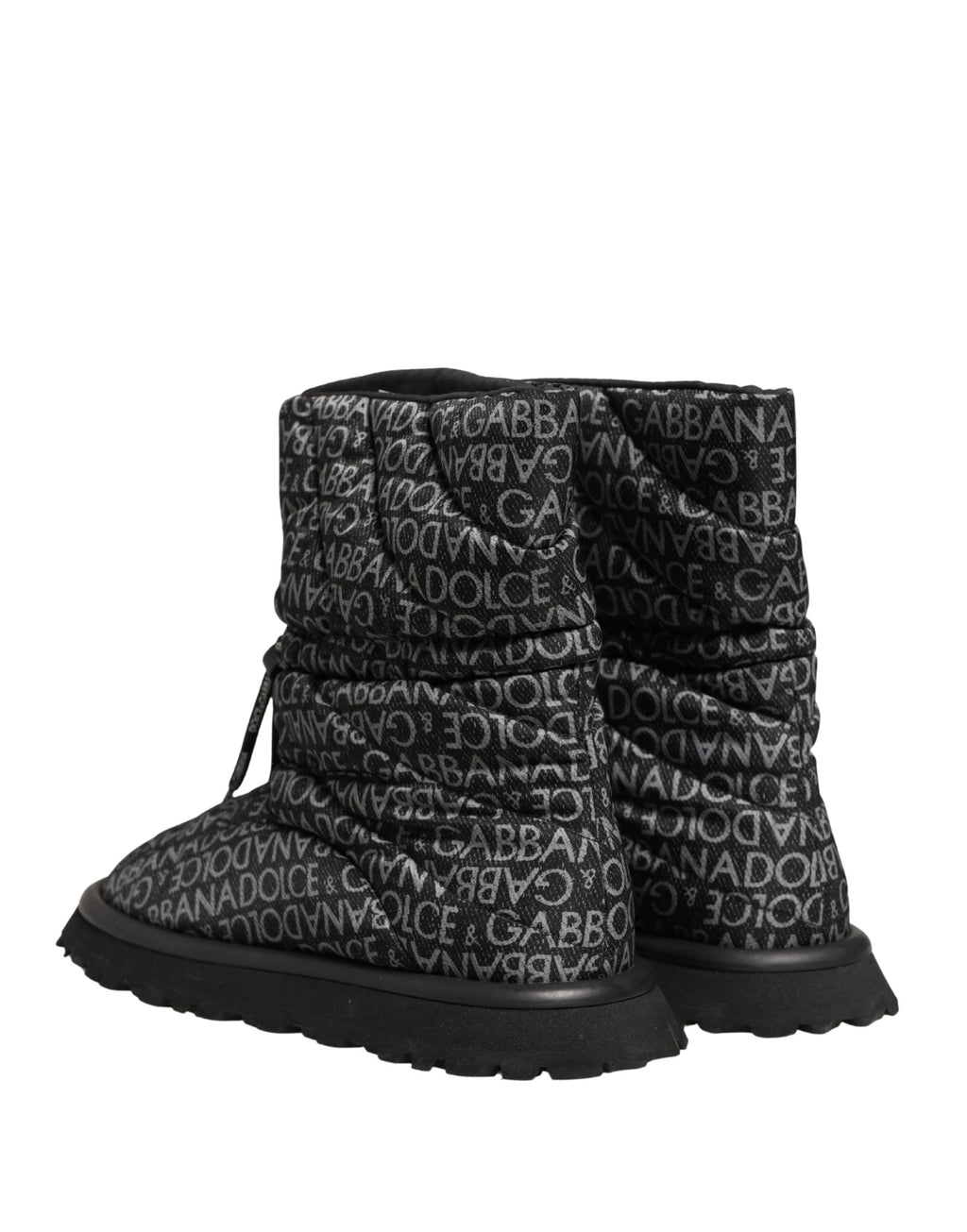 Bottes d'hiver noires Dolce & Gabbana avec logo imprimé en dentelle et laçage, adaptées pour la neige et le froid.