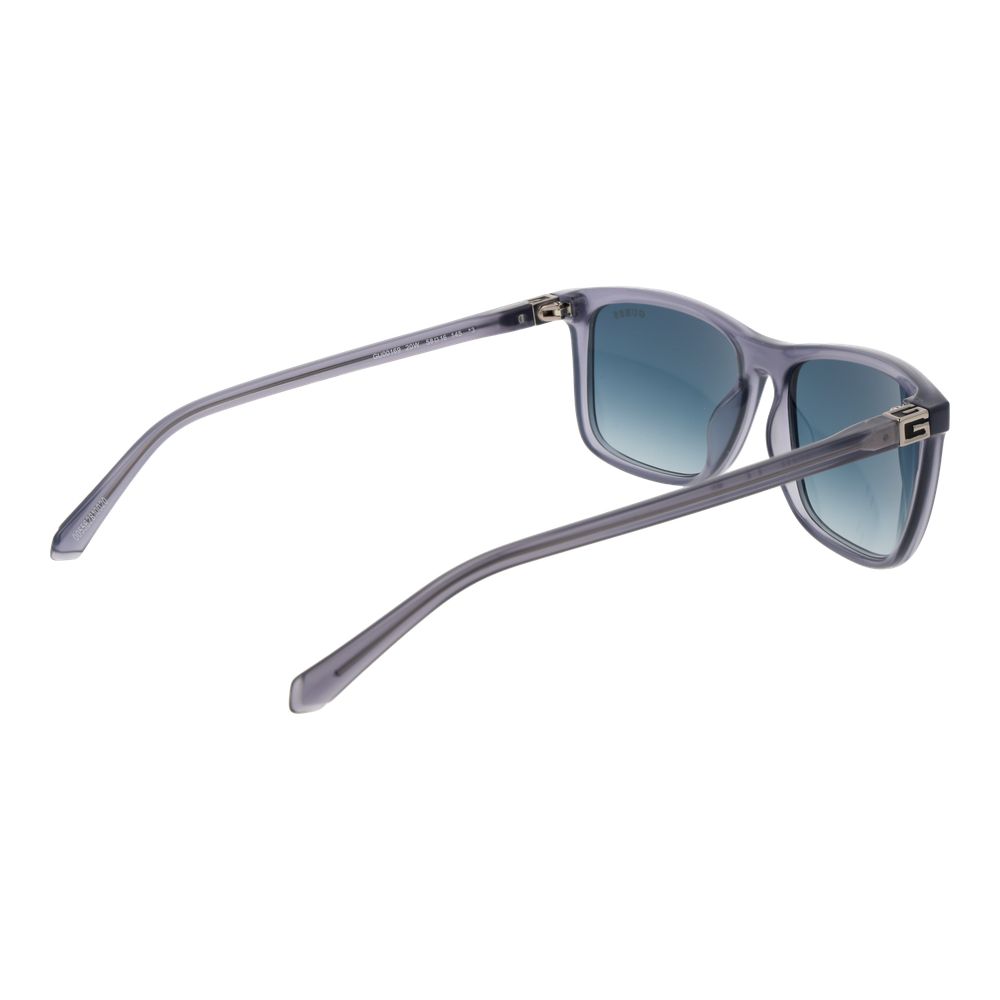 Lunettes de soleil en plastique grises de marque Guess, avec monture élégante et design moderne, vues de face.