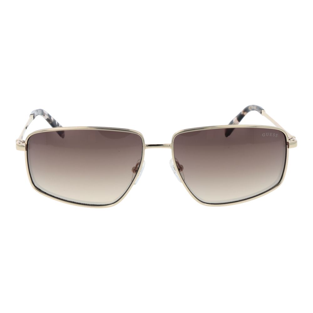 Lunettes de soleil en métal doré Guess, style vintage avec monture élégante et verres foncés.