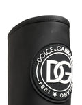 Bottes hautes en cuir caoutchouté noir de Dolce & Gabbana, style élégant et moderne, visibles en gros plan.