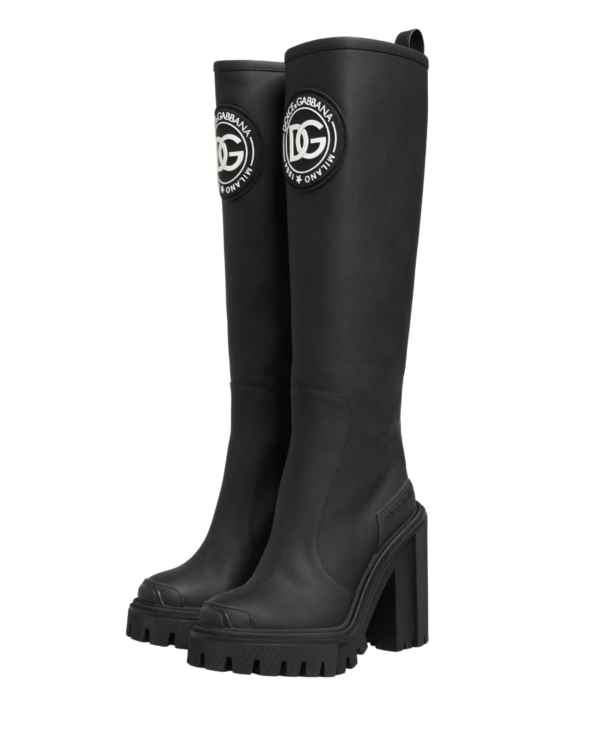 Chaussures bottines en cuir caoutchouté noir de Dolce & Gabbana, style élégant et tendance, vues de face.