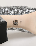 Bottes courtes argentées Dolce & Gabbana en sequins avec élasticité, parfaites pour une tenue élégante et brillante.