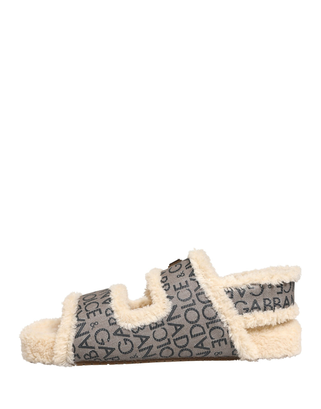 Sandales plates Dolce & Gabbana en faux fourrure beige avec logo imprimé, chaussures élégantes et confortables.