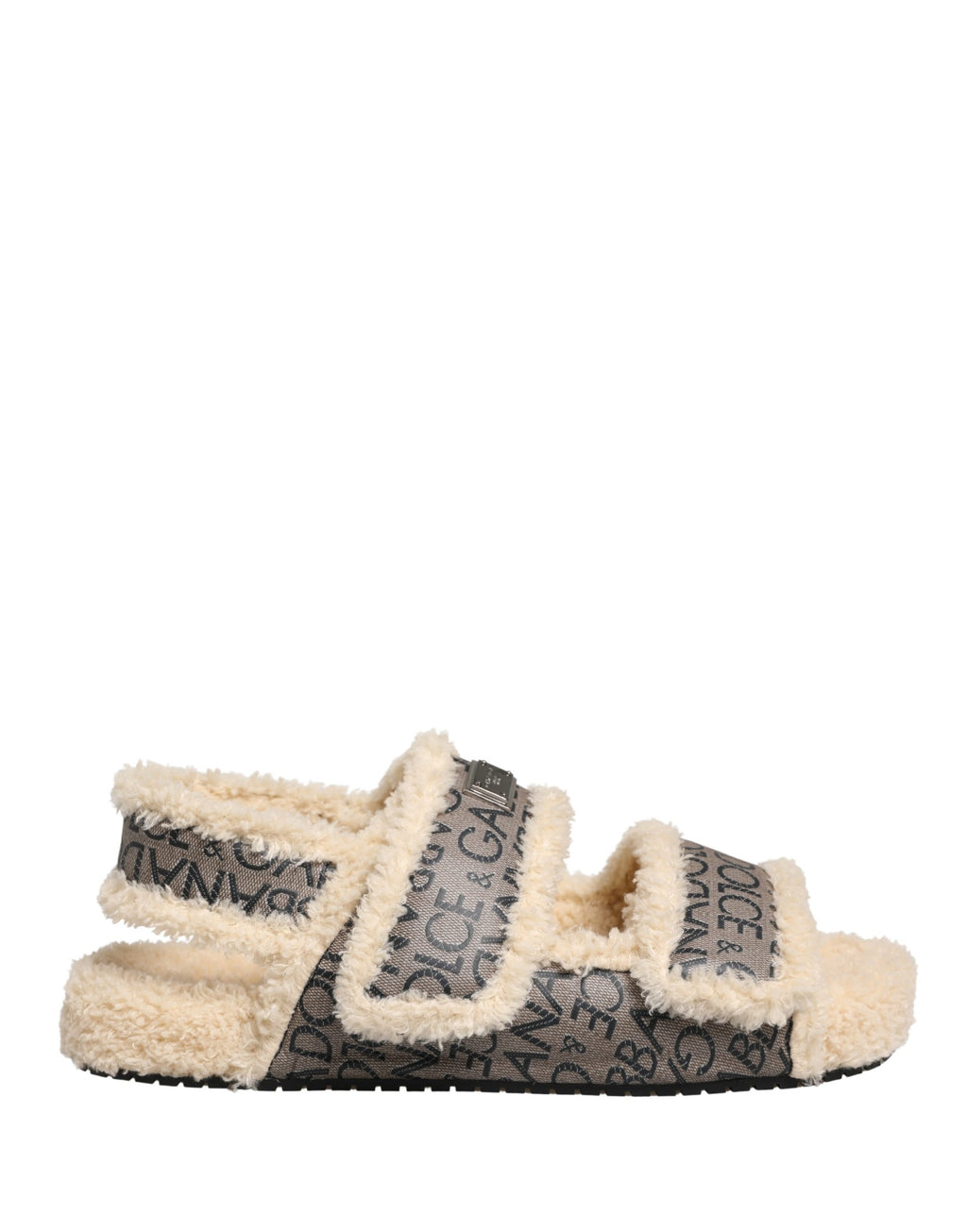 Sandales plates Dolce & Gabbana en fausse fourrure beige avec logo imprimé, chaussures élégantes et confortables.