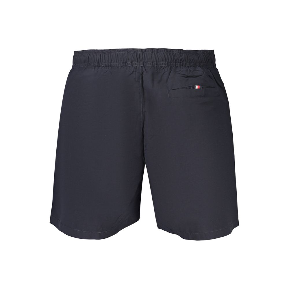 Shorts pour homme Tommy Hilfiger en polyester bleu, style décontracté avec ceinture à cordon, parfait pour l'été.