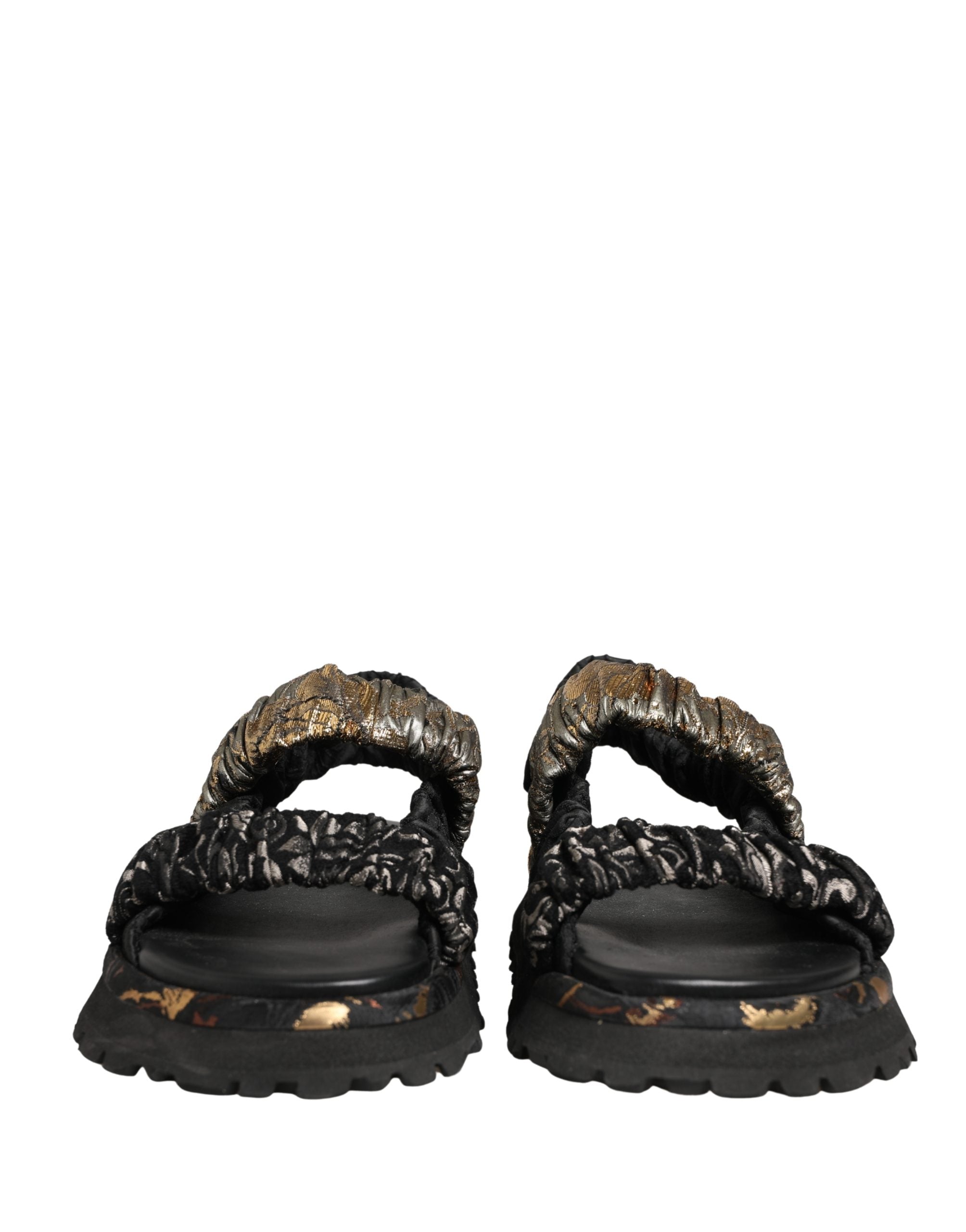 Sandales pour homme Dolce & Gabbana noires avec détails plissés et semelle plate, chaussures élégantes et confortables.