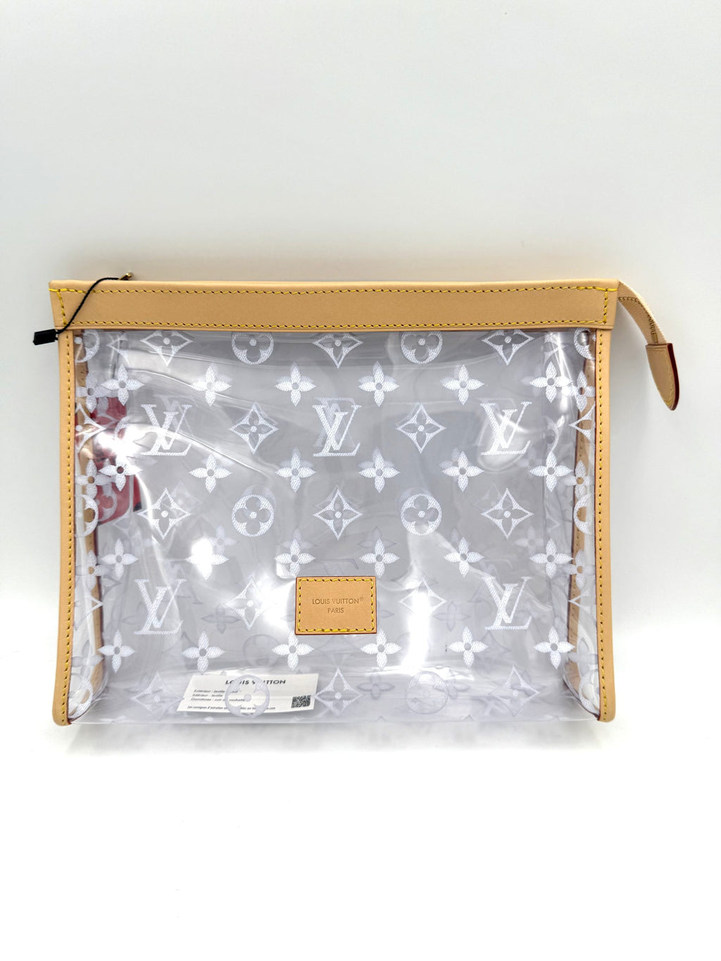 Pochette transparente Louis Vuitton Monogram, en toile avec logo LV, avec fermeture éclair visible et détails en cuir.