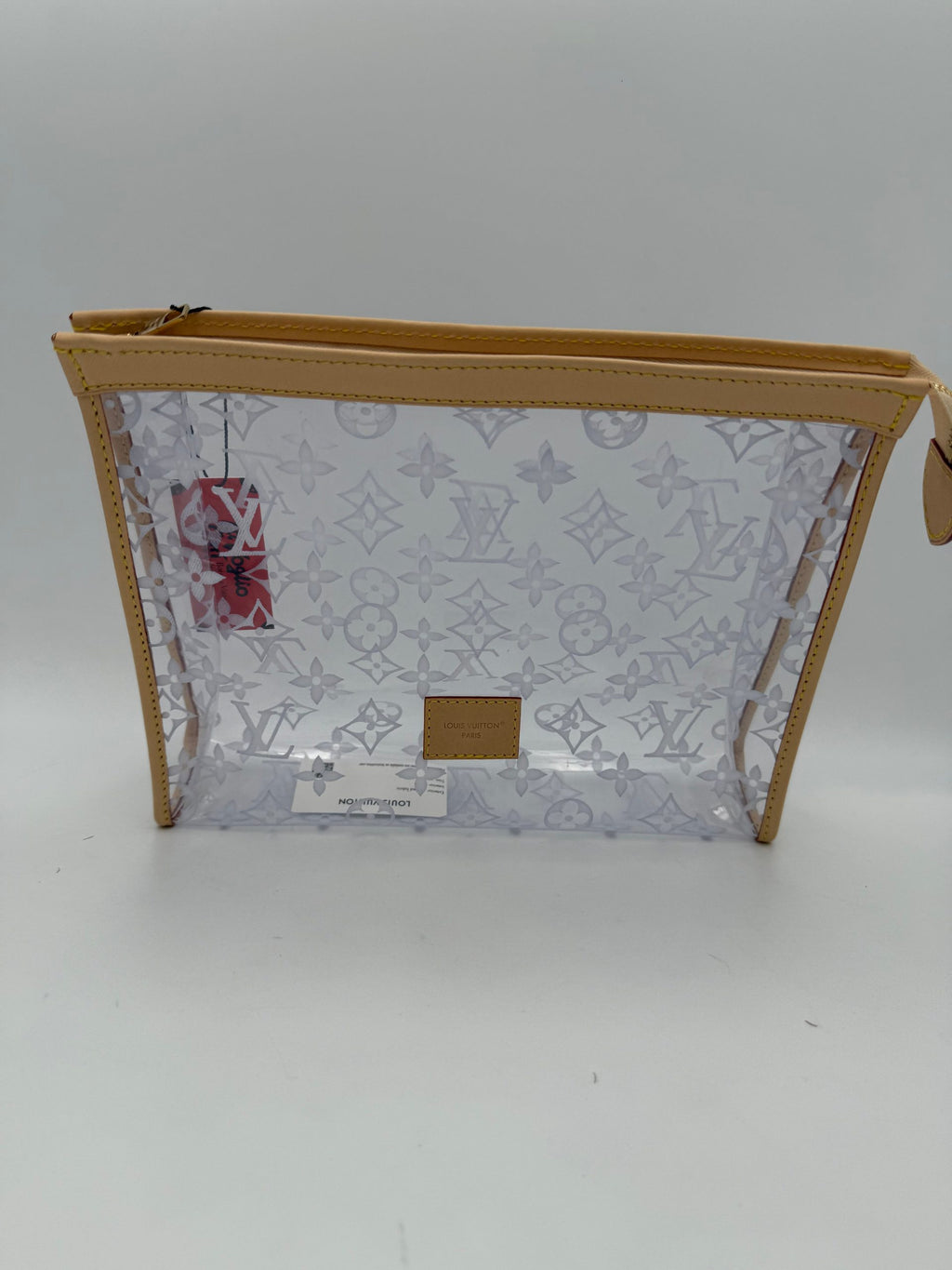 Pochette transparente Monogram de Louis Vuitton avec logo Louis Vuitton, en cuir verni, idéale pour accessoires ou petits objets.