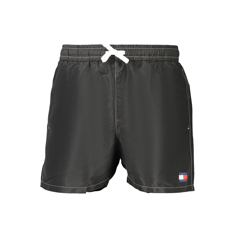 Maillot de bain homme Tommy Hilfiger en polyester noir, style sportif et confortable, avec logo distinctif visible.