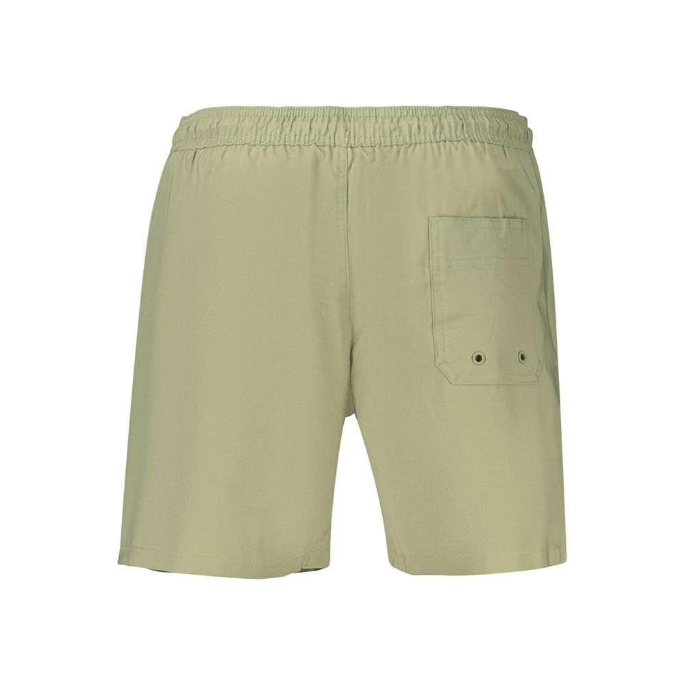 Short de bain pour homme en polyester vert de la marque Calvin Klein, avec ceinture élastique et logo discret.