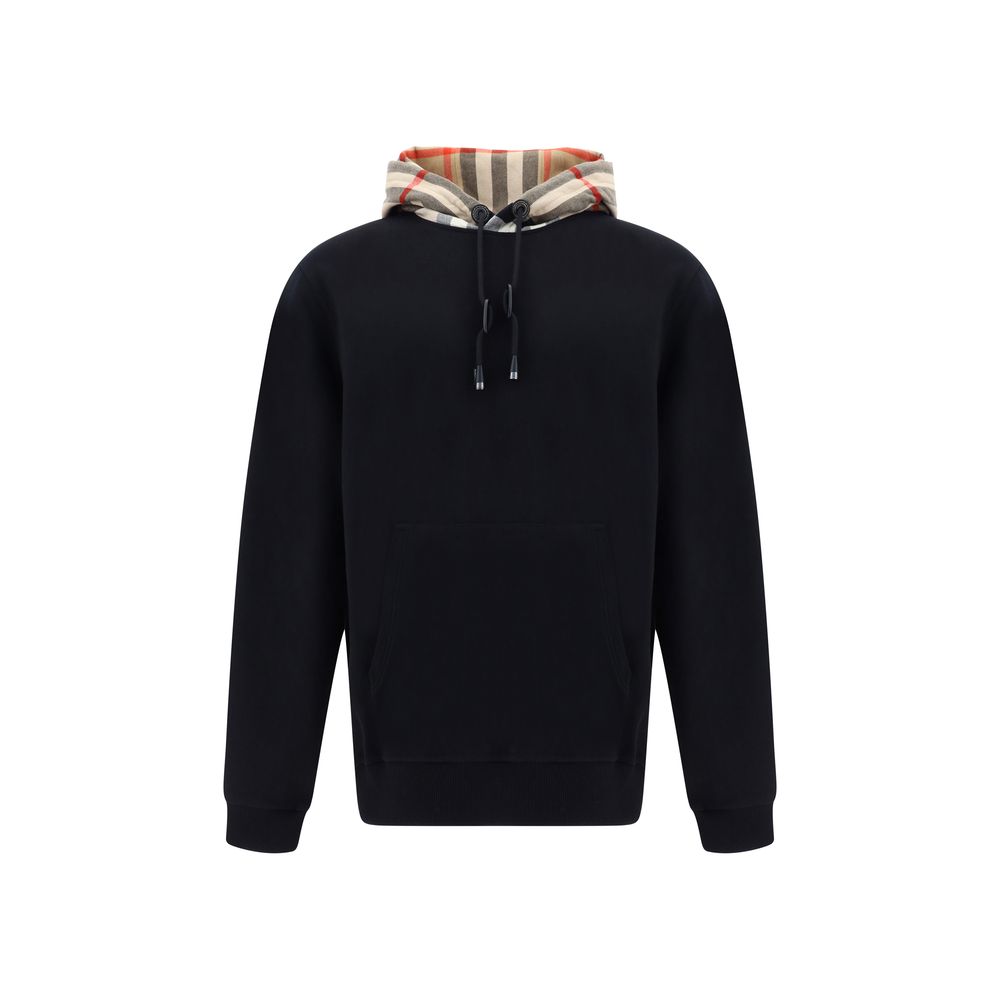 Sweat-shirt noir en coton de la marque Burberry, avec logo discret, porté sur un mannequin.