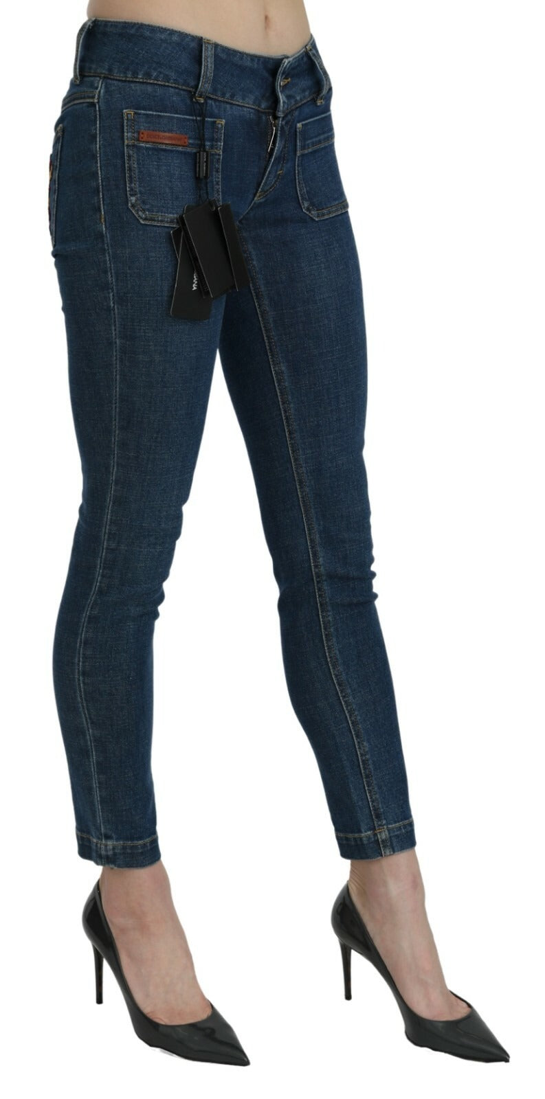 Jeans skinny bleus Dolce & Gabbana, coupe slim, taille moyenne, denim coupé à la taille, style moderne et ajusté.
