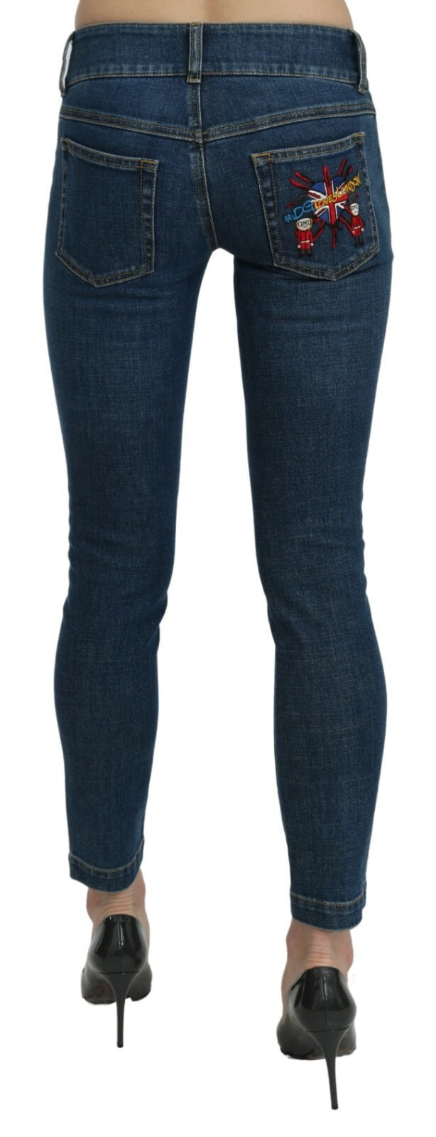 Jeans slim bleus Dolce & Gabbana en denim, coupe cropped, taille mi-haute et ajustée, montrant la texture du tissu et la coupe moderne.