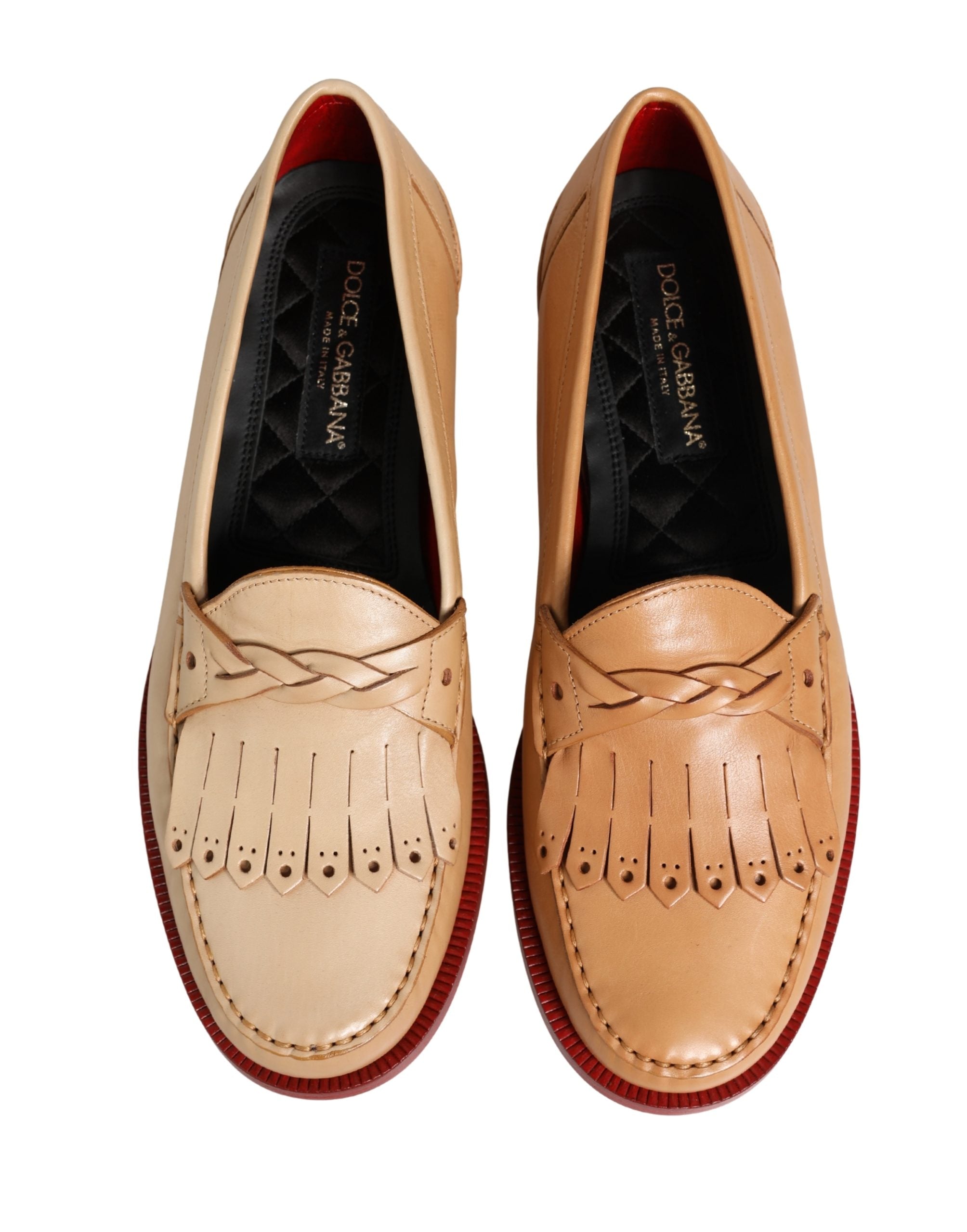 Chaussures mocassins pour homme Dolce & Gabbana en cuir beige avec pompons et franges, style slip-on élégant.
