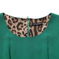 Robe midi verte Dolce & Gabbana à manches courtes, coupe crayon et silhouette élégante.