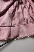 Robe de soirée rose Dolce & Gabbana ornée de sequins et d'embellissements, élégante et sophistiquée.