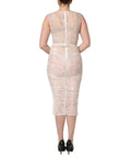 Robe midi en dentelle florale blanche sans manches de Dolce & Gabbana, robe élégante et transparente, détails délicats.