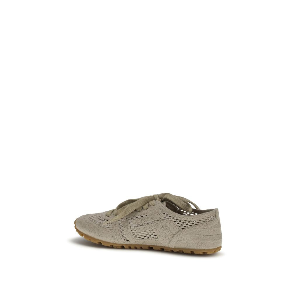 Sneakers athlétiques beige en coton de la marque Balmain, vue de face avec détails du design et des lacets.