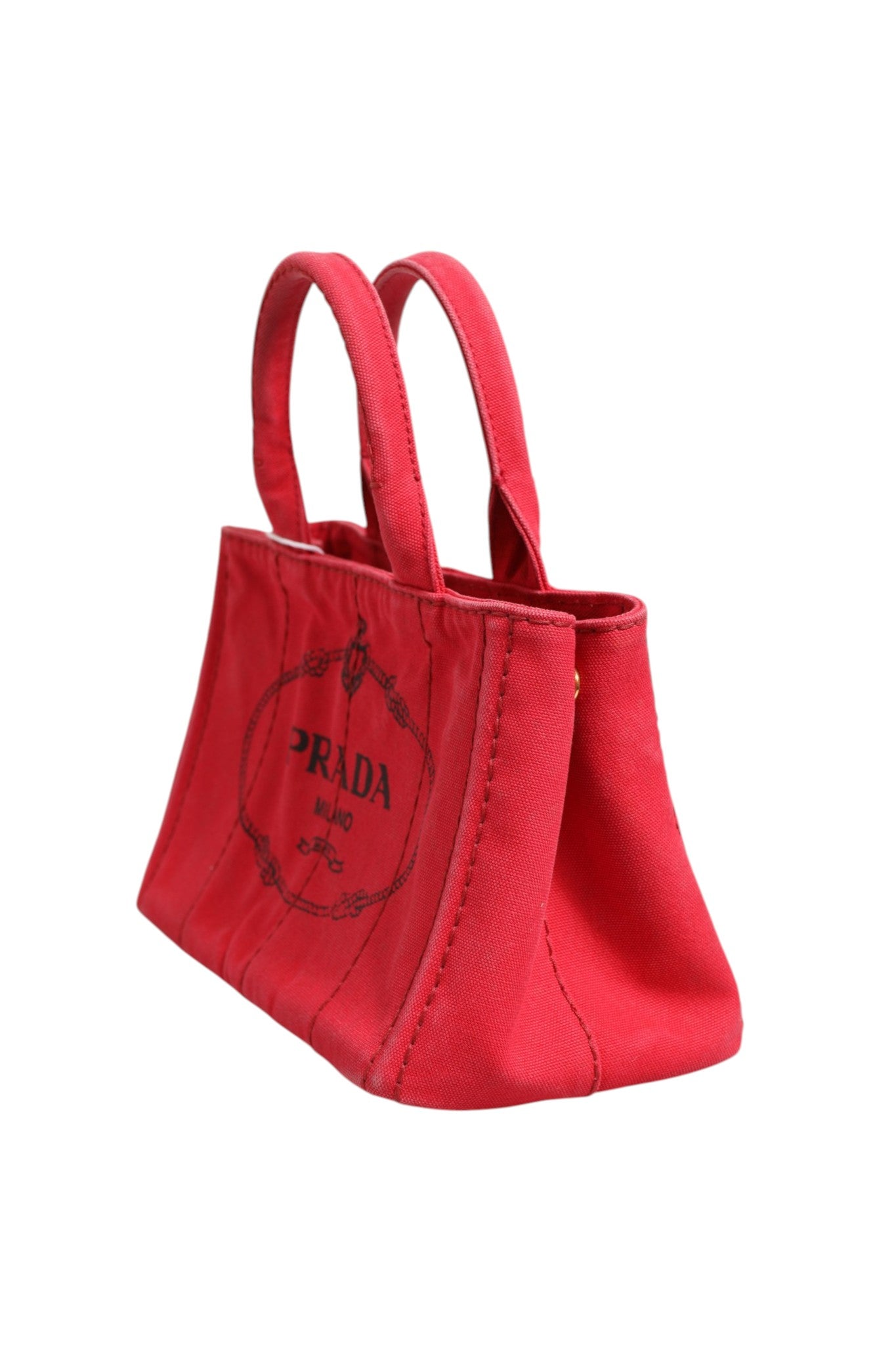 Sac Prada Canapa Mini en toile, sac à main compact avec poignées en corde et logo Prada visible.