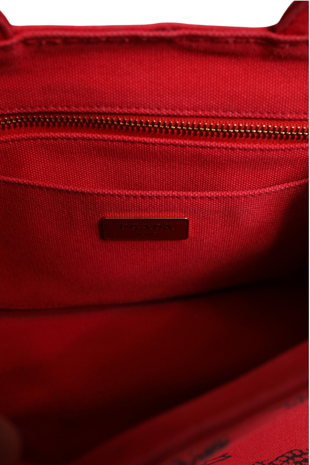 Sac Prada Canapa Mini en toile, petit sac à main en coton tissé avec poignées courtes et logo Prada visible.