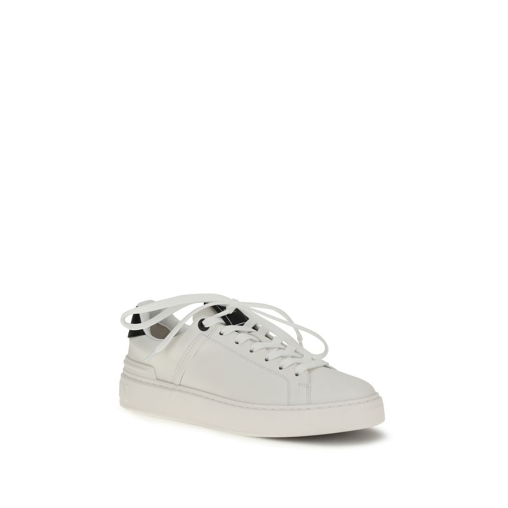Baskets basses en cuir de veau noir Balmain Bos Taurus avec semelle blanche et design élégant.