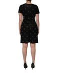 Robe courte noire Dolce & Gabbana DG Crown à manches courtes, coupe ajustée et élégante, en tissu fluide.