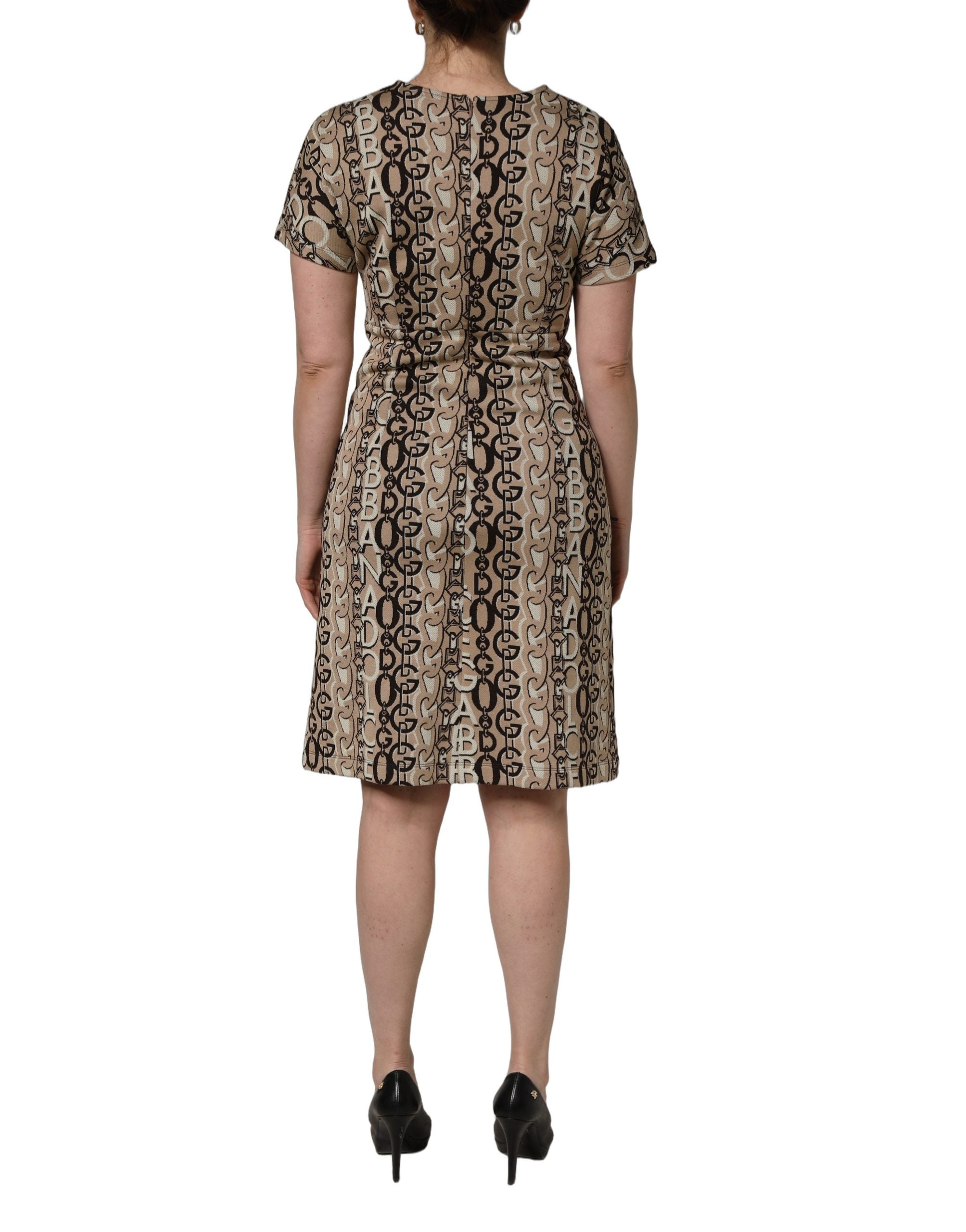 Robe courte Dolce & Gabbana en jersey brun avec logo DG, manches courtes et coupe ajustée, visible sur l'image.