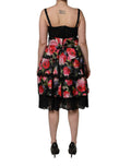 Robe bustier sans manches Dolce & Gabbana noire avec imprimé floral, jupe à plusieurs niveaux et style élégant.