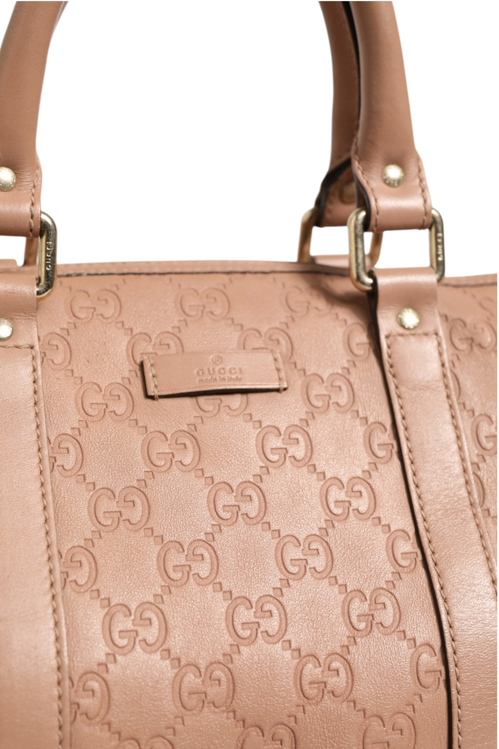 Sac Gucci Joy Boston en cuir noir avec logo Gucci, poignée en cuir et détails métalliques élégants.