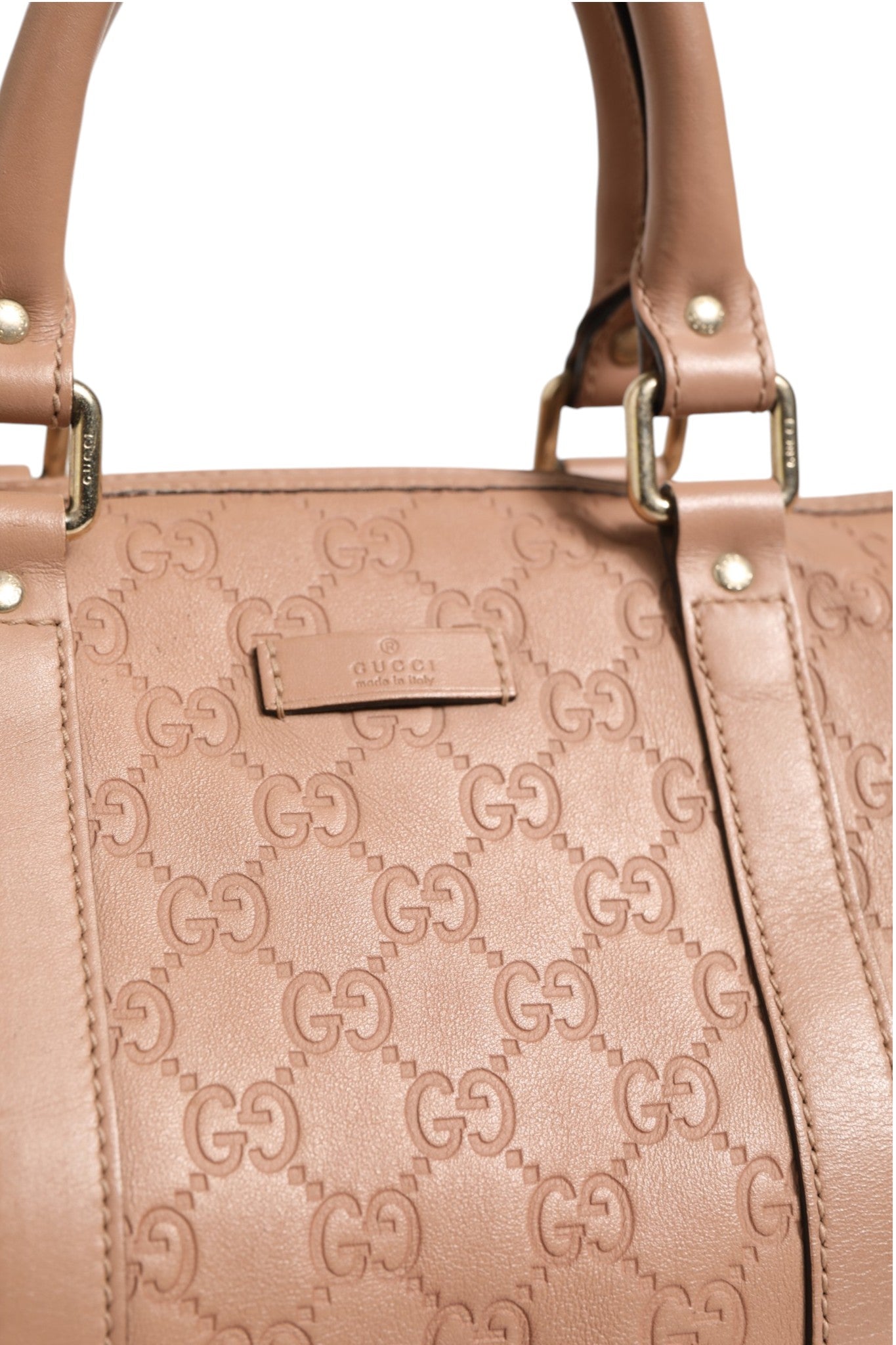 Sac Gucci Joy Boston en cuir noir avec logo Gucci, poignée en cuir et détails métalliques élégants.