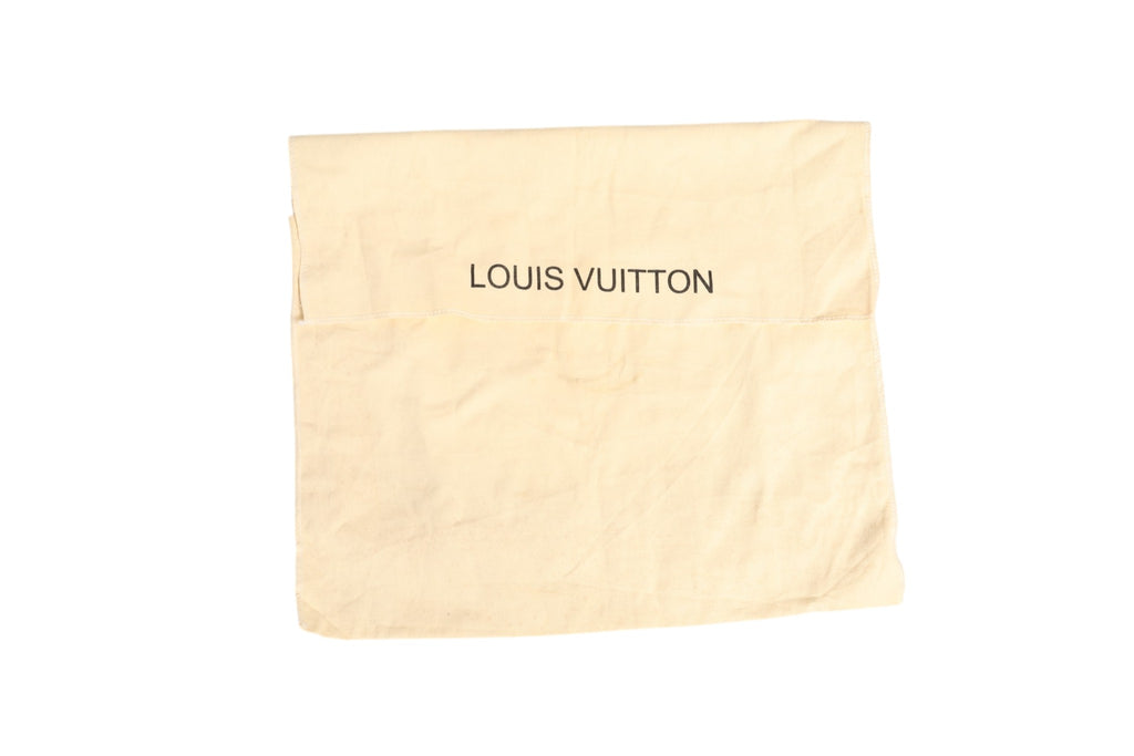 Sac cabas Louis Vuitton Damier Ebene Belmont, motif à damier marron et cuir naturel, avec poignées en cuir et logo Louis Vuitton visible.