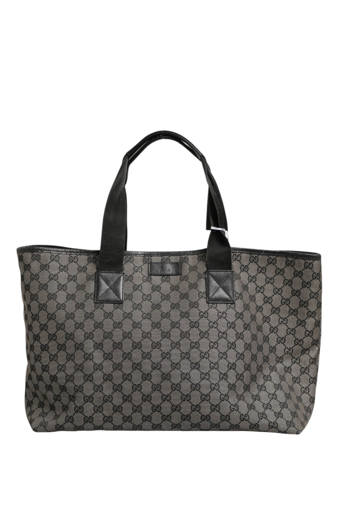 Sac à main Gucci GG en toile, grand modèle tote avec poignées robustes et logo emblématique, pour un style élégant.