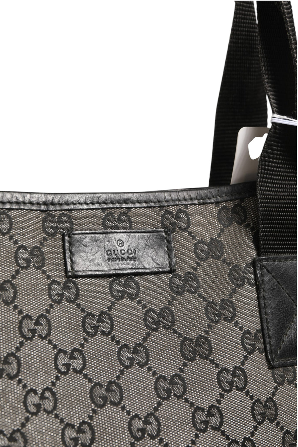 Sac shopper en toile Gucci GG, grand format, avec poignées en cuir, motif emblématique de la marque Gucci.