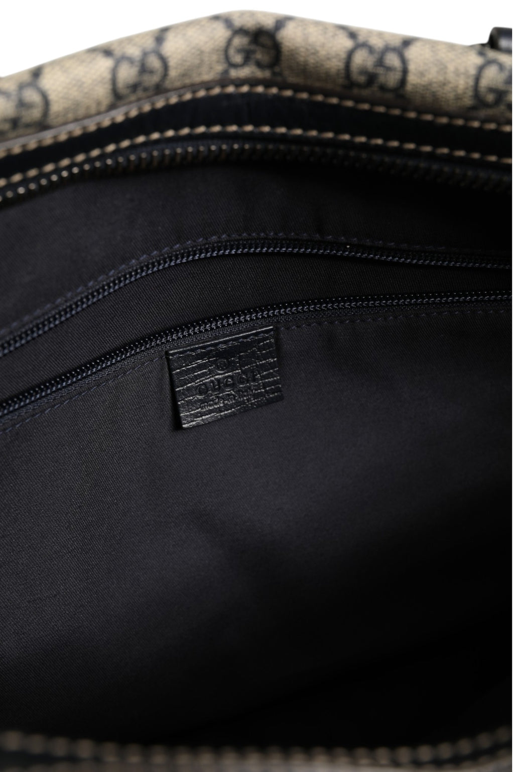 Sac à main Gucci GG Supreme Boston avec poignées en cuir et logo Gucci, en tissu monogrammé beige et marron.