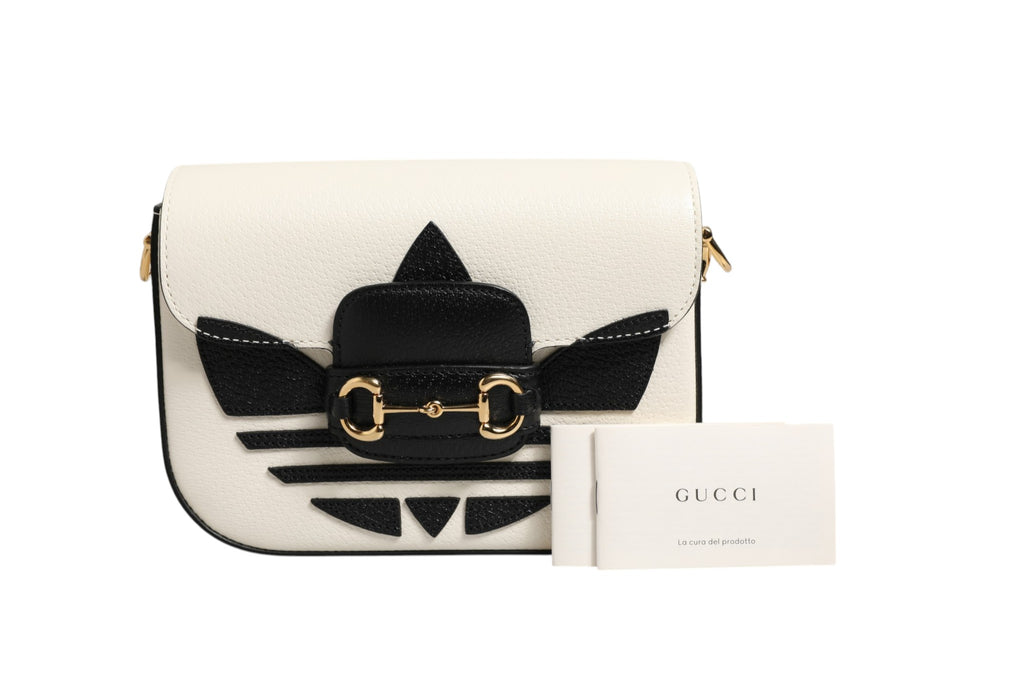 Sac à bandoulière Gucci x Adidas 1955 Horsebit, en cuir avec logo, design élégant et détails sophistiqués.