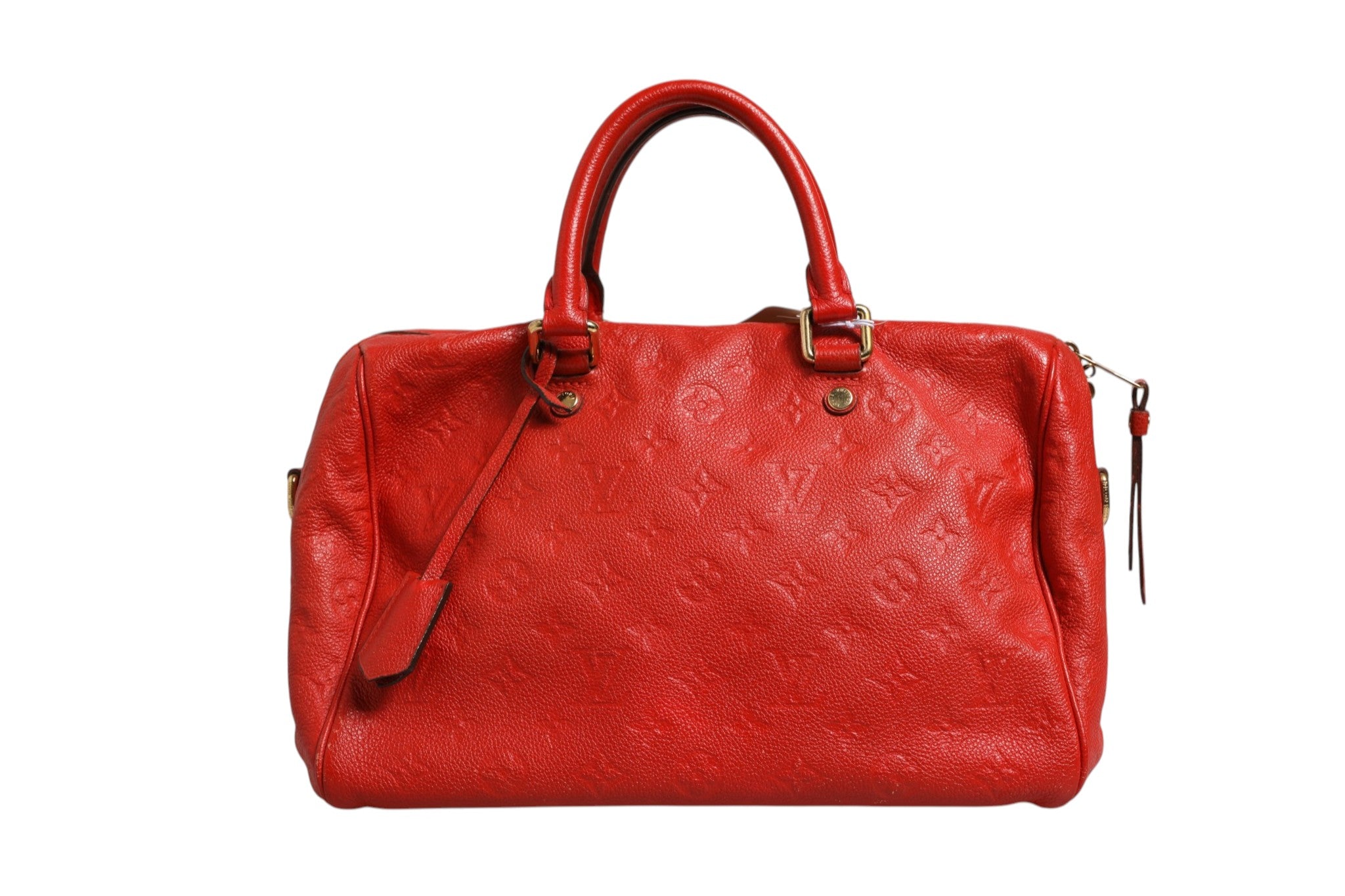 Sac à main Louis Vuitton Speedy Bandoulière 30 en Monogram Empreinte rouge, avec bandoulière et détails en cuir naturel.