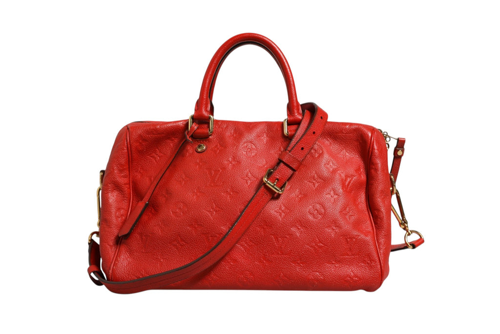 Sac à main Louis Vuitton Speedy Bandoulière 30 en cuir Monogram Empreinte rouge, avec logo LV et bandoulière réglable.