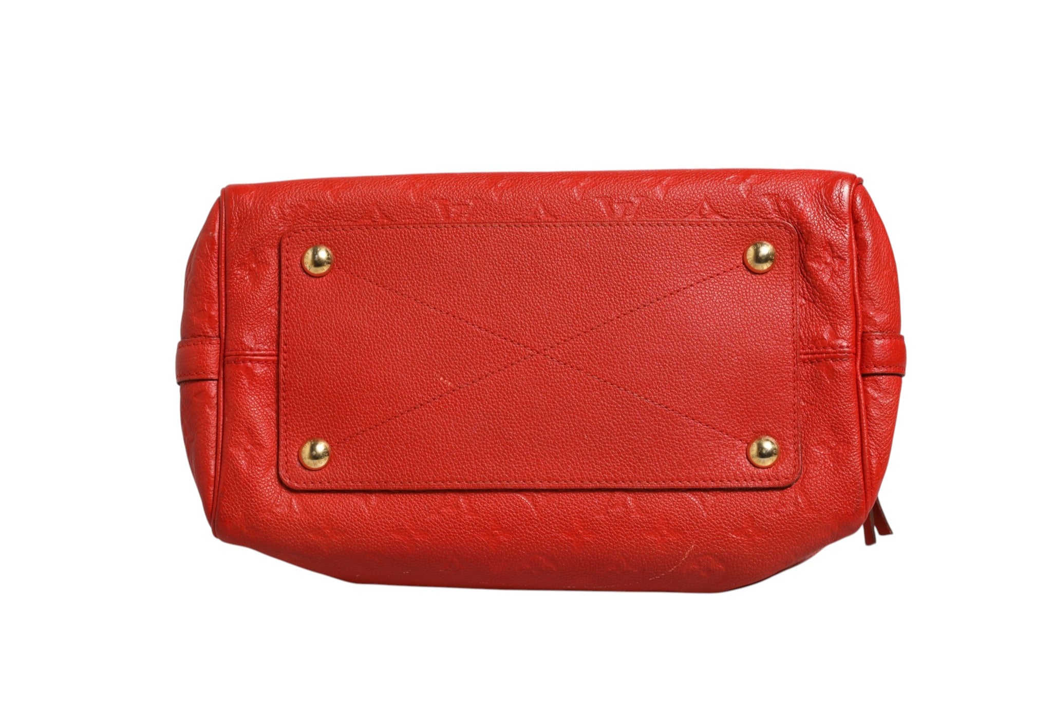 Sac à main Louis Vuitton Speedy Bandoulière 30 en cuir Monogram Empreinte rouge, avec poignées et bandoulière ajustable.