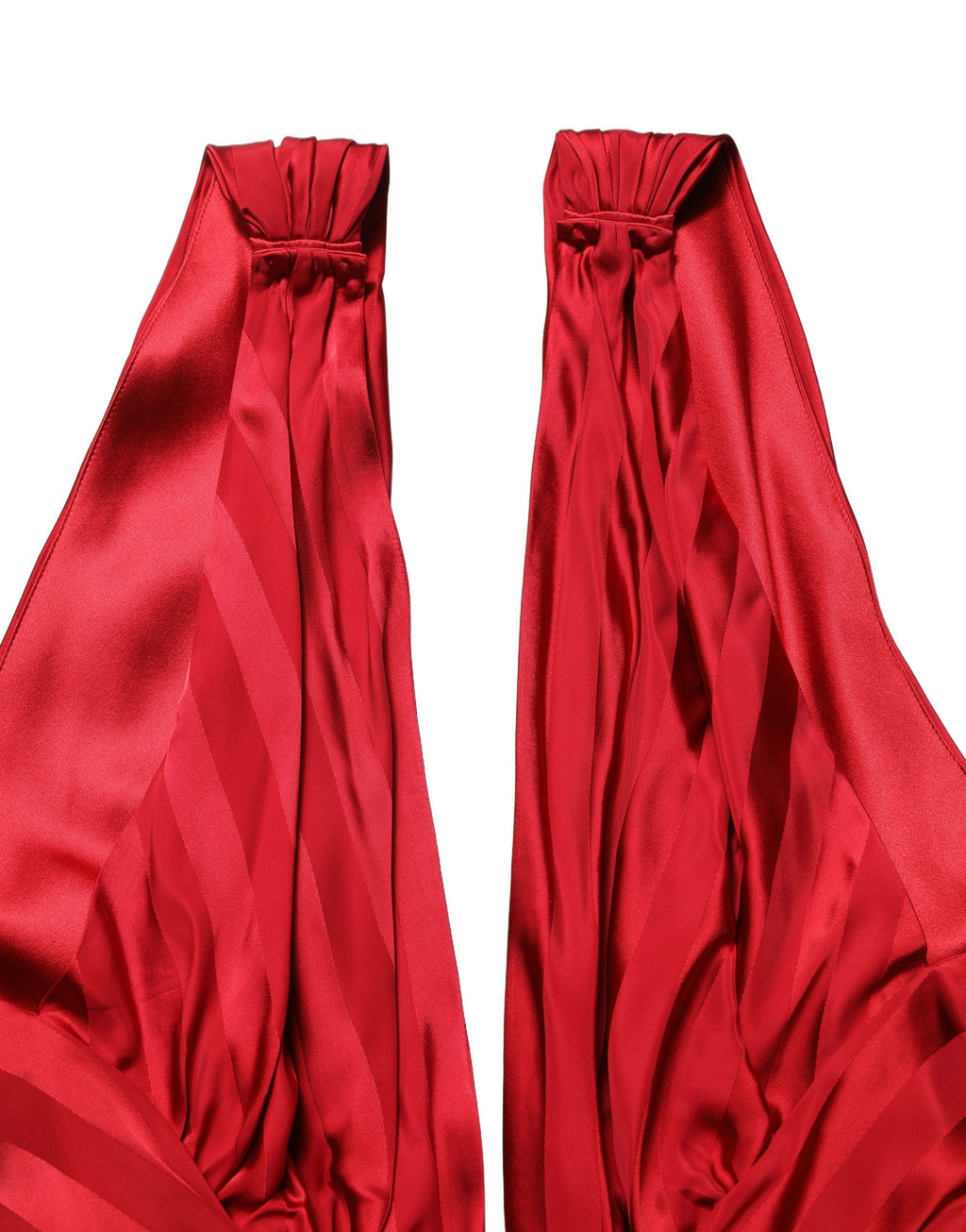 Combinaison rouge Dolce & Gabbana à décolleté plongeant et taille drapée, style élégant et sophistiqué.