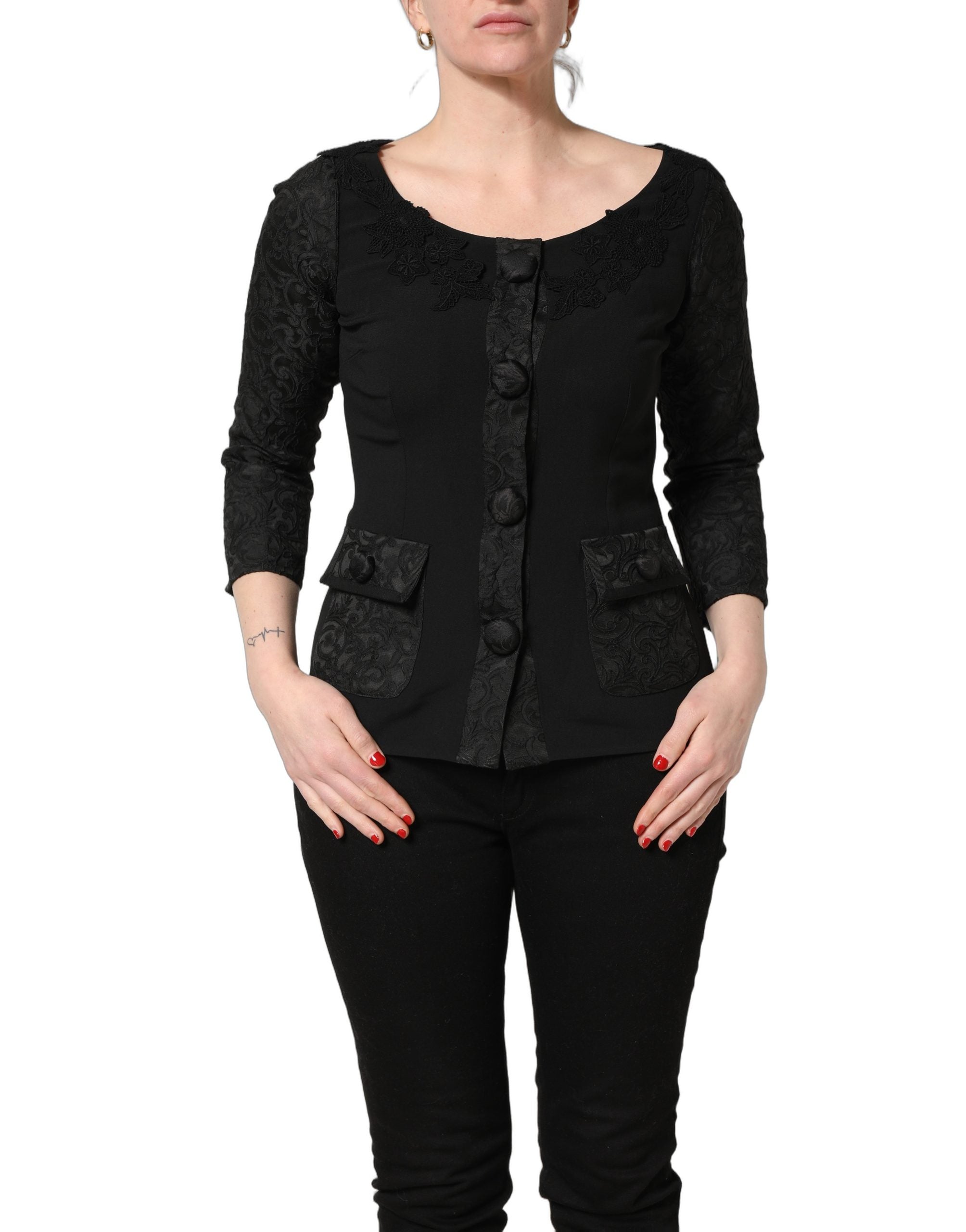 Veste blazer Dolce & Gabbana noire avec boutons, détails en dentelle et finition élégante.