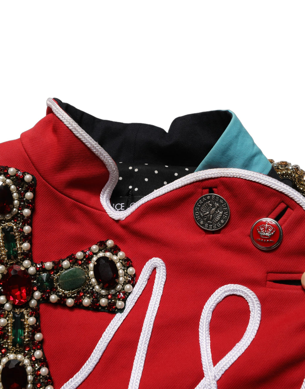 Veste courte asymétrique ornée de bijoux multicolores Dolce & Gabbana avec détails élaborés et design unique.